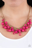 Paparazzi Tour de Trendsetter - Pink - Necklace  -  Varying in shape, glassy and polished pink beads swing from the bottom of interlocking gold chains. Crystal-like teardrops are sprinkled along the colorful beading, creating a flirtatious fringe below the collar. Features an adjustable clasp closure.
