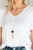 Paparazzi Belle Of The BALLROOM - Purple A dramatic pearly purple bead swings from the bottom of an elegantly elongated gold chain. Featuring a hammered fitting, a gold tassel streams from the bottom of the colorful pendant for a refined finish. Features an adjustable clasp closure.
