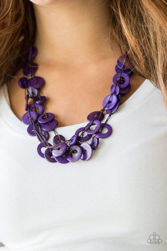 Paparazzi Wonderfully Walla Walla - Purple  -  Shiny brown cording knots around mismatched purple wooden beads, creating vivacious layers. Features a button loop closure.
