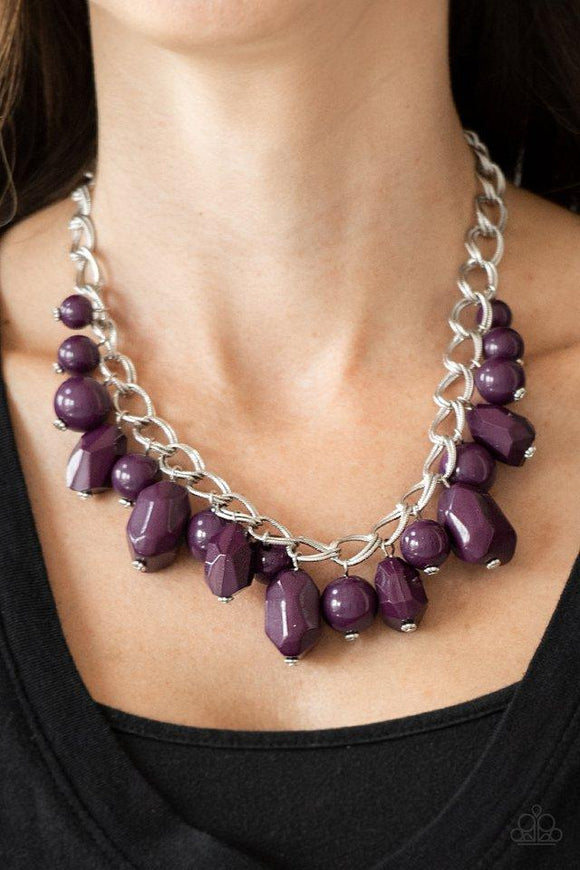 Paparazzi Gorgeously Globetrotter - Purple Varying in shape and shimmer, smooth and faceted purple beads trickle from doubled silver chain links, creating a colorful fringe below the collar. Features an adjustable clasp closure.


