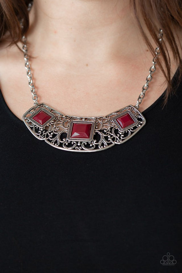 Paparazzi Feeling Inde-PENDANT - Red - Necklace  -  Glistening silver filigree spins into a dramatic pendant below the collar. Square red beads are pressed into the airy frame for a colorful finish. Features an adjustable clasp closure.
