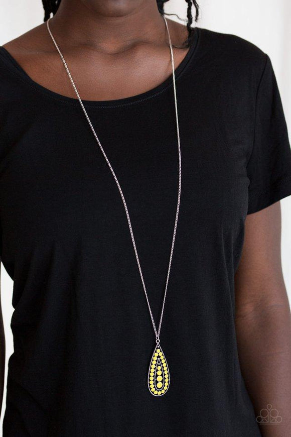 Paparazzi Tiki Tease- Yellow Brushed in a sunny yellow finish, a bubbly silver teardrop swings from the bottom of an elongated silver chain for a tribal inspired look. Features an adjustable clasp closure.

