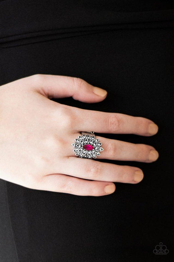 Paparazzi Blooming Fireworks - Pink  -  Dotted in dainty white rhinestones, silver petals radiate from a regal pink marquise shaped rhinestone center for an edgy look. Features a stretchy band for a flexible fit.

