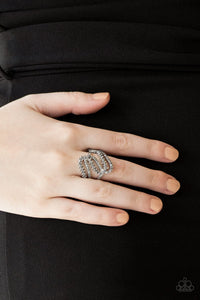 Paparazzi Make Waves - Silver Encrusted in dainty hematite and smoky rhinestones, radiant silver ribbons wave across the finger, coalescing into a whimsical band. Features a stretchy band for a flexible fit.
