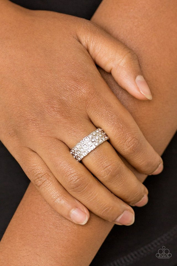 Paparazzi Feeling Fab-YOU-less - White - Ring  -  Row after row of dazzling white rhinestones are encrusted along a dainty silver band, creating timeless shimmer. Features a dainty stretchy band for a flexible fit.
