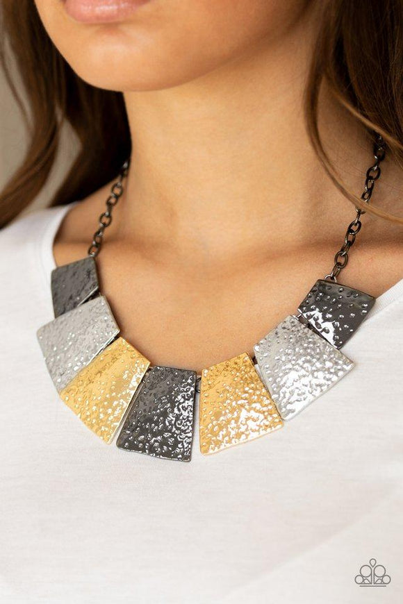 Paparazzi Here Comes The Huntress - Multi Featuring flared edges, delicately hammered gunmetal, silver, and gold plates link below the collar for a fierce look. Features an adjustable clasp closure.

