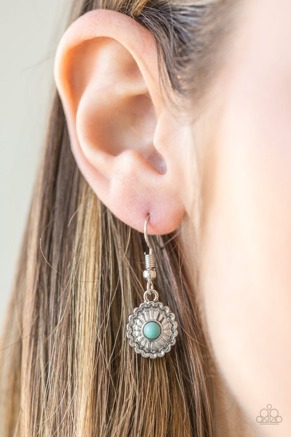 Paparazzi Wild In Wildflowers - Blue A dainty turquoise stone is pressed into a shimmery silver frame radiating with floral details for a seasonal look. Earring attaches to a standard fishhook fitting.
