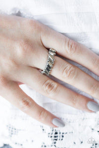 Paparazzi Money Hungry - Silver Featuring regal emerald-style cuts, dainty hematite rhinestones slant across the finger, coalescing into a glamorous band. Features a dainty stretchy band for a flexible fit.
