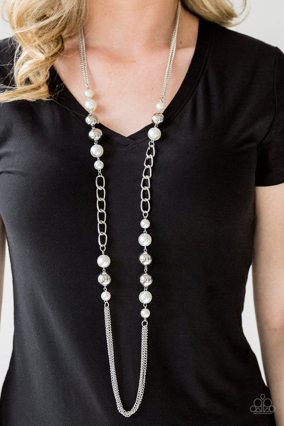 Paparazzi Uptown Talker - White Varying in size, pearly white and oversized silver beads give way to sections of bold silver chain. Layers of silver chains drape across the bottom of the design for a flawless finish. Features an adjustable clasp closure.
