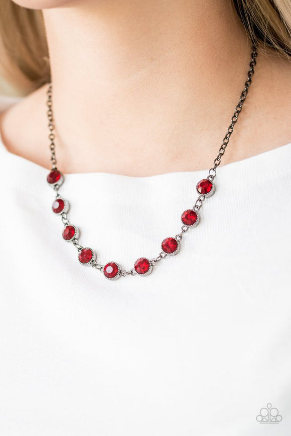Paparazzi Starlit Socials - Red - Necklace  -  Encased in studded gunmetal frames, fiery red rhinestones link below the collar for a glamorous look. Features an adjustable clasp closure.
