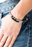 Paparazzi Downright Dressy - Black Classic silver beads, faceted black crystal-like beads, and dainty silver discs are threaded along stretchy bands, creating shimmery layers across the wrist.

