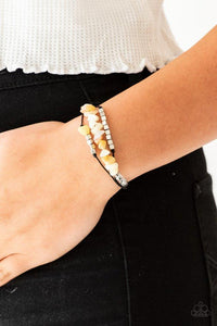 Paparazzi Nature Novice - Yellow Bits of natural yellow stone, clear beads, and silver cube beads are threaded along strands of dainty black cording for a seasonal look. Features an adjustable sliding knot closure.

