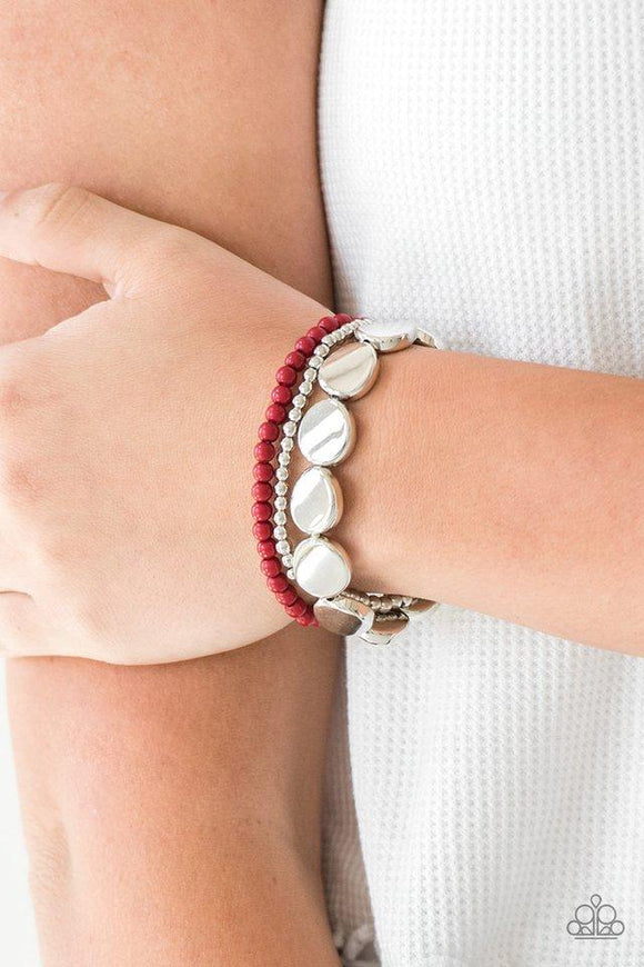 Paparazzi Beyond The Basics - Red Mismatched silver and red beads and round silver accents are threaded along stretchy bands, creating colorful layers around the wrist.
