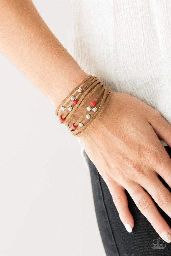 Paparazzi Colorfully Coachella - Red Dainty red wooden beads and classic silver beads are threaded along strands of brown suede, creating colorful layers across the wrist. Features an adjustable clasp closure.

