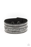 Paparazzi Really Rock Band - Black - Bracelet  -  Rows of shimmery gunmetal chains, glittery hematite rhinestones, and metallic prism rhinestones are sprinkled along a thick black suede band for a sassy style. Features an adjustable snap closure.
