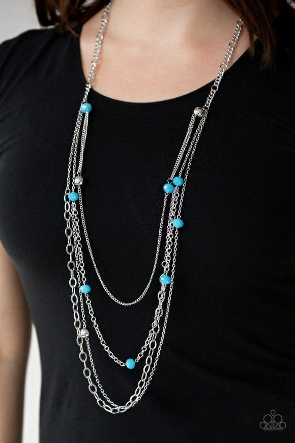 Paparazzi Glamour Grotto- Blue Opaque blue crystal-like beads and shimmery silver beads trickle along mismatched silver chains, creating refined layers down the chest. Features an adjustable clasp closure.

