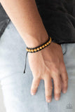 Paparazzi Rural Rover - Yellow Earthy wooden beads are threaded along black shiny cording around the wrist for a seasonal look. Features an adjustable sliding knot closure.

