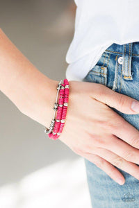 Paparazzi Tribal Spunk - Pink Mismatched silver accents and disc shaped pink beading slides along stretchy spring-like wires for a spunky tribal look.
