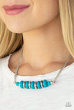 Paparazzi On Mountain Time - Blue Etched in circular patterns, silver beads join refreshing blue beading below the collar. Infused with double stranded chain, dainty silver accents are added to the colorful palette for a handcrafted, artisanal finish. Features an adjustable clasp closure.

