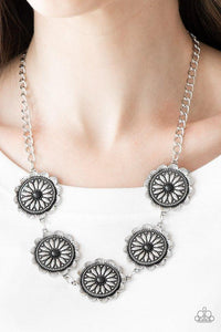 Paparazzi Medallions Myself and I- Black Infused with shiny black beaded centers, ornate floral stamped frames link below the collar for a colorfully, seasonal look. Features an adjustable clasp closure.

