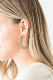Paparazzi The HOOP Up - Silver  -  Radiating with hammered detail, an asymmetrical silver hoop curls around the ear for a casual look. Earring attaches to a standard post fitting. Hoop measures 2" in diameter.
