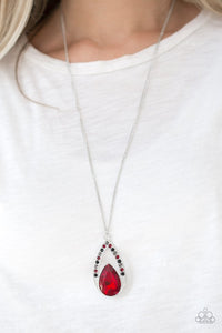 Paparazzi Notorious Noble - Multi - Necklace  -  A fiery red teardrop gem is pressed into a silver frame radiating with black, hematite, and red rhinestones. The glamorous pendant swings from the bottom of a shimmery silver chain for a refined look. Features an adjustable clasp closure.
