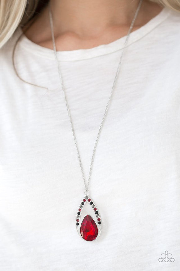 Paparazzi Notorious Noble - Multi - Necklace  -  A fiery red teardrop gem is pressed into a silver frame radiating with black, hematite, and red rhinestones. The glamorous pendant swings from the bottom of a shimmery silver chain for a refined look. Features an adjustable clasp closure.
