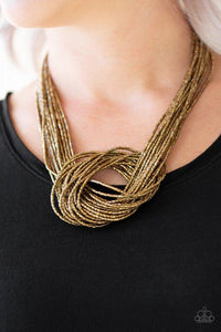 Paparazzi Knotted Knockout - Brass Countless strands of brass seed beads delicately knot together below the collar to create an unforgettable statement piece. Features an adjustable clasp closure.
