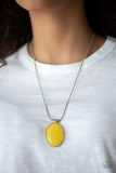 Paparazzi Rising Stardom - Yellow  -  Featuring sleek silver fittings, a glowing yellow bead slides along a rounded snake chain below the collar for a dramatic pop of color. Features an adjustable clasp closure.
