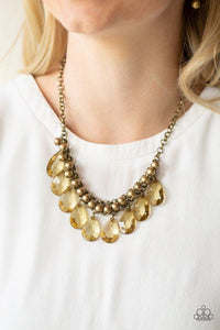 Paparazzi Fashionista Flair - Brass Necklace - A row of antiqued brass beads gives way to glassy brass teardrops, creating a bold tone on tone fringe below the collar. Features an adjustable clasp closure. 
