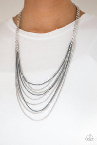 Paparazzi Rebel Rainbow - Silver Strands of bold silver links give way to rows of shimmery silver and shiny gray chains, creating colorful layers down the chest. Features an adjustable clasp closure.
