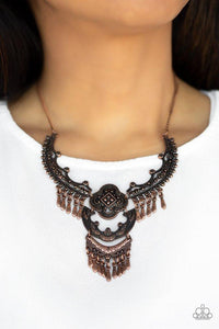 Paparazzi Rogue Vogue - Copper A collection of antiqued copper plates connects below the collar, joining into an elaborate pendant. The floral dotted frames give way to sections of copper beaded fringe, adding hints of movement to the tribal inspired piece. Features an adjustable clasp closure.
