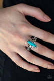 Paparazzi Desert Canyons - Blue  -  A dainty turquoise stone bead is pressed into the center of an antiqued silver frame radiating with glistening filigree for a seasonal look. Features a dainty stretchy band for a flexible fit.

