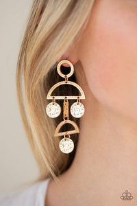 Paparazzi Incan Eclipse - Gold  -  Delicately hammered and etched in shimmery textures, a collection of gold discs and gold frames connect into a tribal inspired lure. Earring attaches to a standard post earring.
