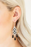 Paparazzi Majestic Mood - Black Dotted with dainty black beads, a silver kite-shaped frame is encrusted in glassy white rhinestones. Shiny black beads swing from the bottom of the sparkling frame for a refined flair. Earring attaches to a standard fishhook fitting.

