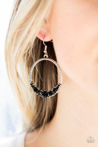 Paparazzi SelfMade Millionaire- Black The bottom of a textured silver hoop is encrusted in glittery black rhinestones for a glamorous look. Earring attaches to a standard fishhook fitting.

