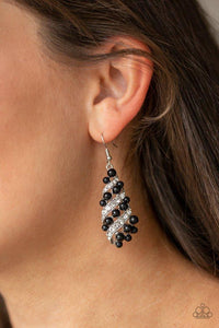 Paparazzi Ballroom Waltz- Black White rhinestone encrusted ribbons wrap around a shiny black beaded teardrop frame for a timeless look. Earring attaches to a standard fishhook fitting.

