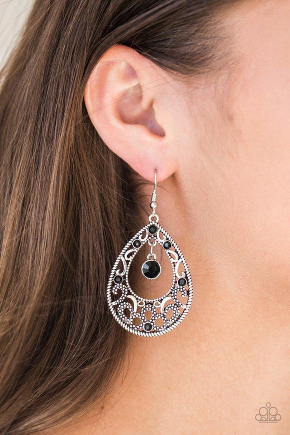 Paparazzi Gotta Get That Glow - Black Glistening and studded silver filigree swirls along a shimmery silver frame radiating with glittery black rhinestones. A sparkling black rhinestone swings from the top of the frame for a refined finish. Earring attaches to a standard fishhook fitting.

