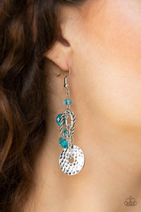 Paparazzi Seaside Catch - Blue  -  Glittery blue crystal-like beads trickle along a lure featuring a hammered silver disc and twisted silver fittings for an abstract look. Earring attaches to a standard fishhook fitting.
