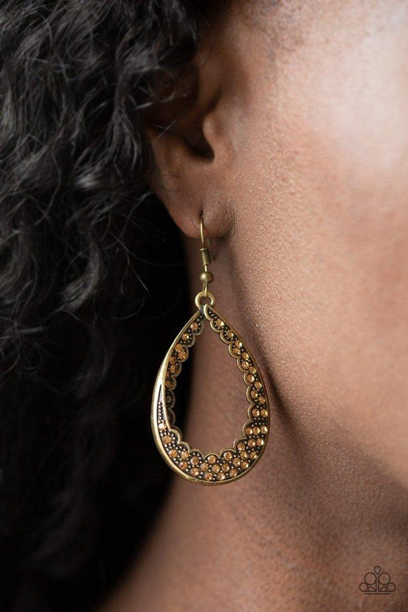 Paparazzi Royal Treatment - Brass Dotted with dainty brass studs, the inside and outside of a brass teardrop is encrusted in golden topaz rhinestones for a regal look. Earring attaches to standard fishhook fitting.

Get The Complete Look!
Necklace: 