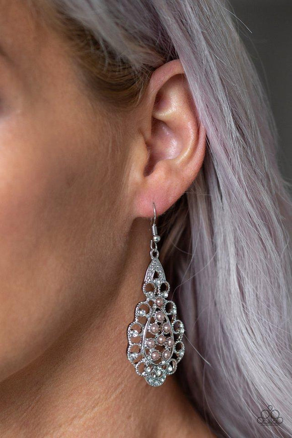 Paparazzi Sprinkle On The Sparkle - Brown  -  Dotted with glassy white rhinestones, elegant silver filigree curls around a brown pearl dotted center for a regal look. Earring attaches to a standard fishhook fitting.
