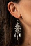 Paparazzi Majestic Mood - White Dotted with dainty white pearls, a silver kite-shaped frame is encrusted in glassy white rhinestones. Teardrop pearls swing from the bottom of the sparkling frame for a refined flair. Earring attaches to a standard fishhook fitting.

