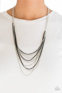 Paparazzi Rebel Rainbow - Black Strands of bold silver links give way to rows of shimmery silver and shiny black chains, creating colorful layers down the chest. Features an adjustable clasp closure.

