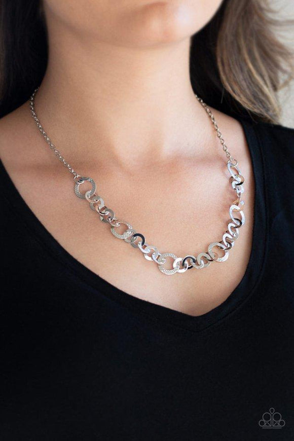 Paparazzi Move It On Over - Silver Smooth and textured silver hoops connect below the collar for a modern industrial look. Features an adjustable clasp closure.

