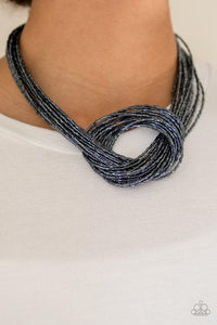 Paparazzi Knotted Knockout - Blue Countless strands of metallic blue seed beads delicately knot together below the collar to create an unforgettable statement piece. Features an adjustable clasp closure.

