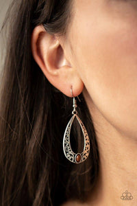 Paparazzi Colorfully Charismatic - Brown A shiny brown bead is pressed into the bottom of a teardrop frame embossed in silver vine-like filigree for a whimsical look. Earring attaches to a standard fishhook fitting.
