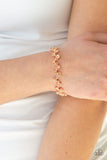 Paparazzi Starlit Stunner - Copper - Bracelet  -  Varying in size, a collection of rhinestones connect across the wrist for a timeless look. Features an adjustable clasp closure.
