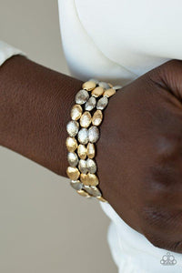 Paparazzi Basic Bliss - Multi Radiating with shimmery textures, dainty gold and silver beads are threaded along stretchy bands around the wrist for a casually layered look.

