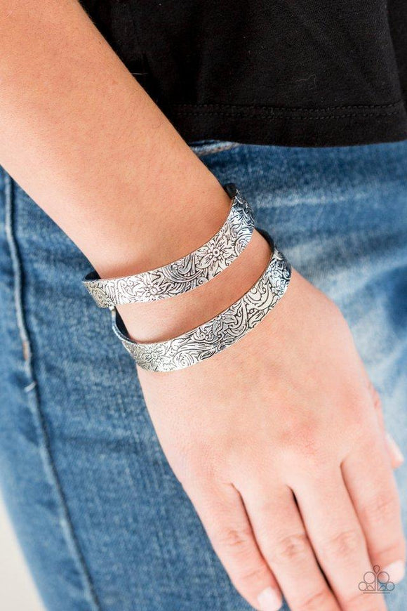 Paparazzi Garden Goddess - Silver Stamped in a whimsical floral pattern, an antiqued silver cuff curls around the wrist in a seasonal fashion.

