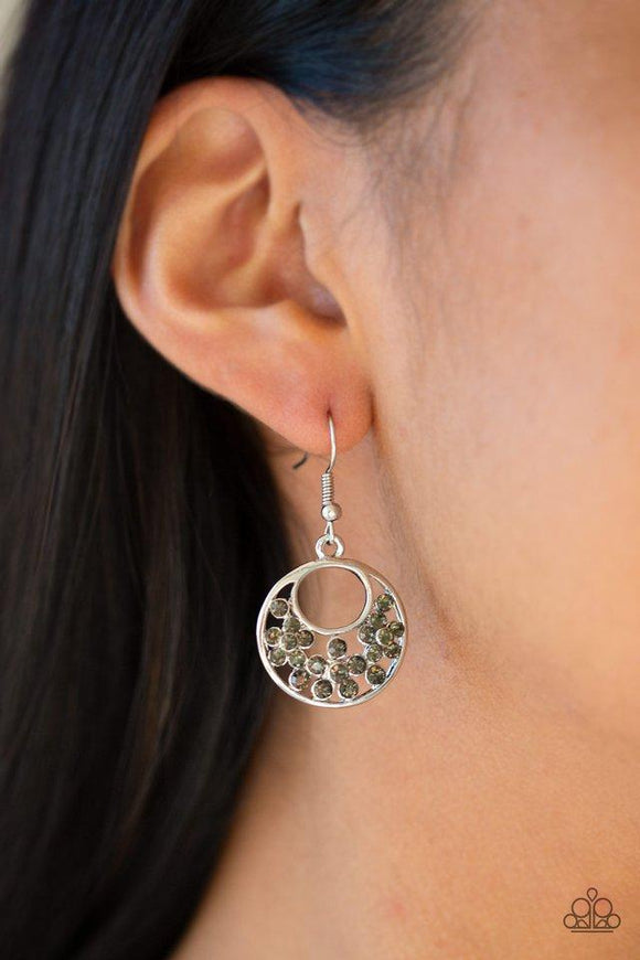 Paparazzi Sugary Shine - Silver Smoky rhinestones are sprinkled across the center of an airy silver hoop for a whimsical look. Earring attaches to a standard fishhook fitting.

